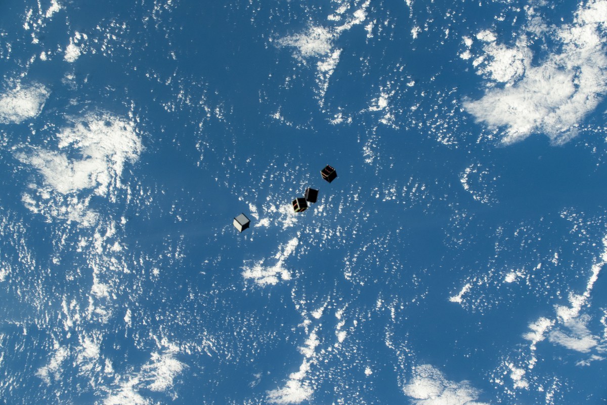 CubeSats deployed into Earth orbit from the International Space Station, photographed from the ISS cupola.